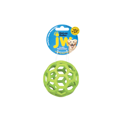 A light green dog ball toy with holes, hanging on a label tag with a dog.