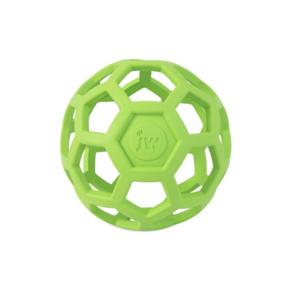 A bright green ball dog toy with holes. 