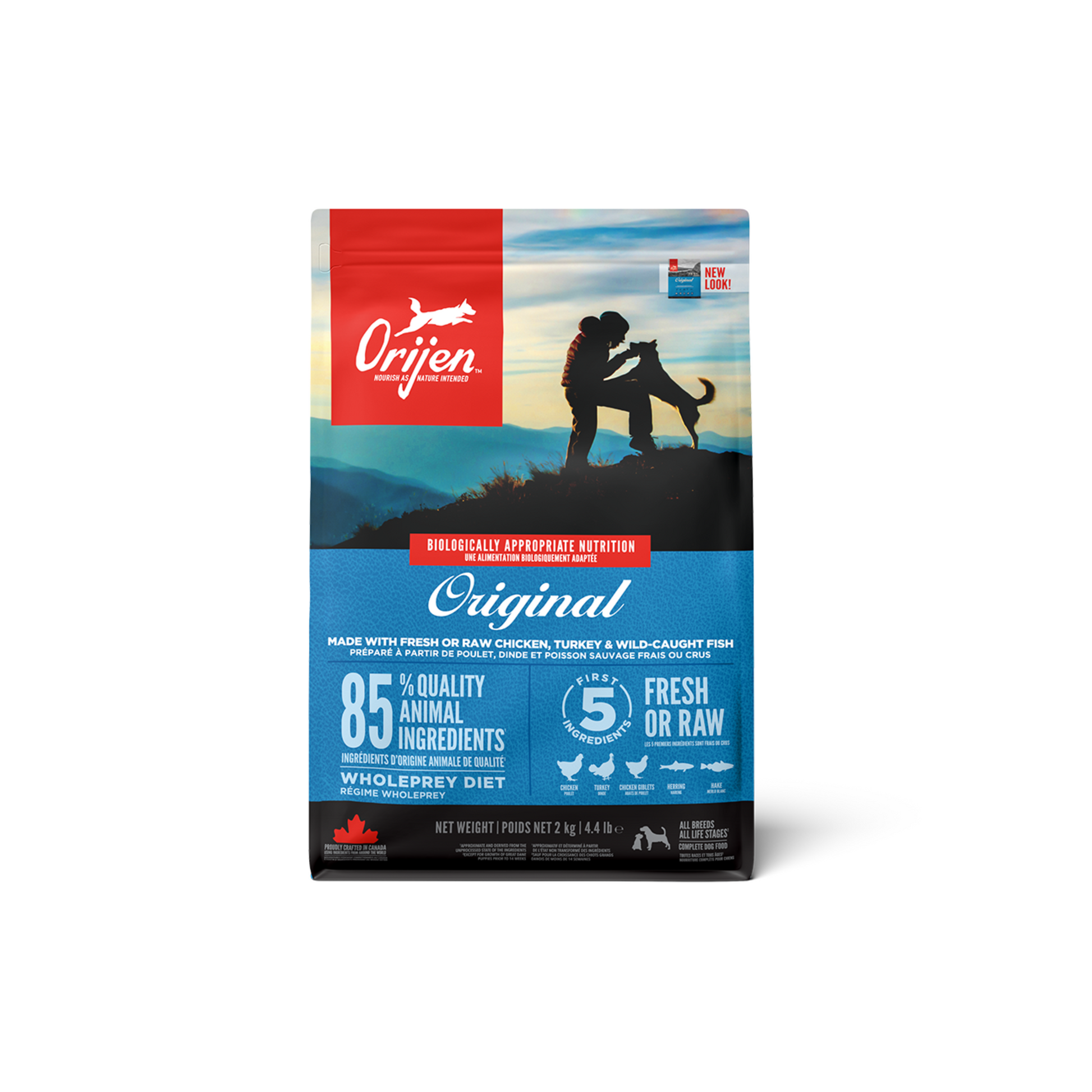 A package of ORIJEN Original Dog Food with a picture of a dog and a person on a mountainous landscape.