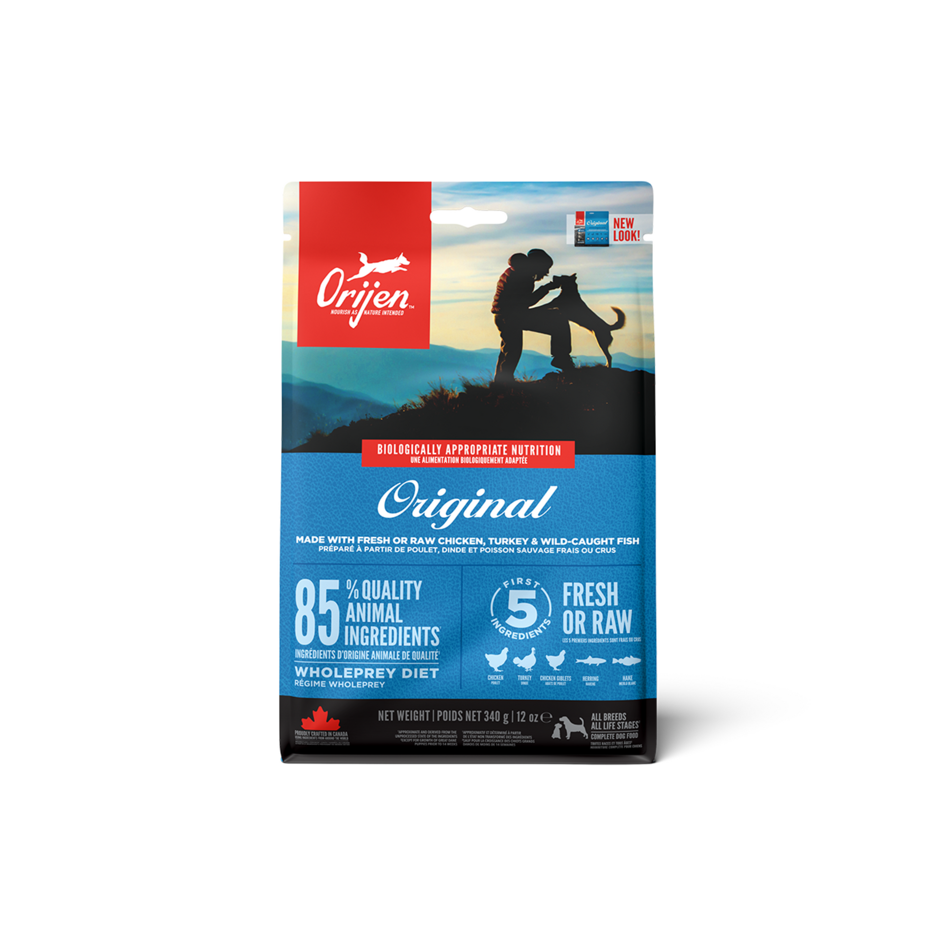 A package of ORIJEN Original Dog Food with a picture of a dog and a person on a mountainous landscape.